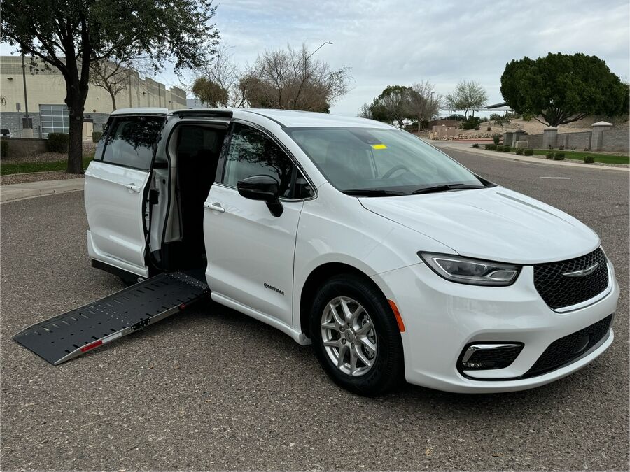 White Chrysler Pacifica with Driverge Side Entry Automatic Fold Out conversion