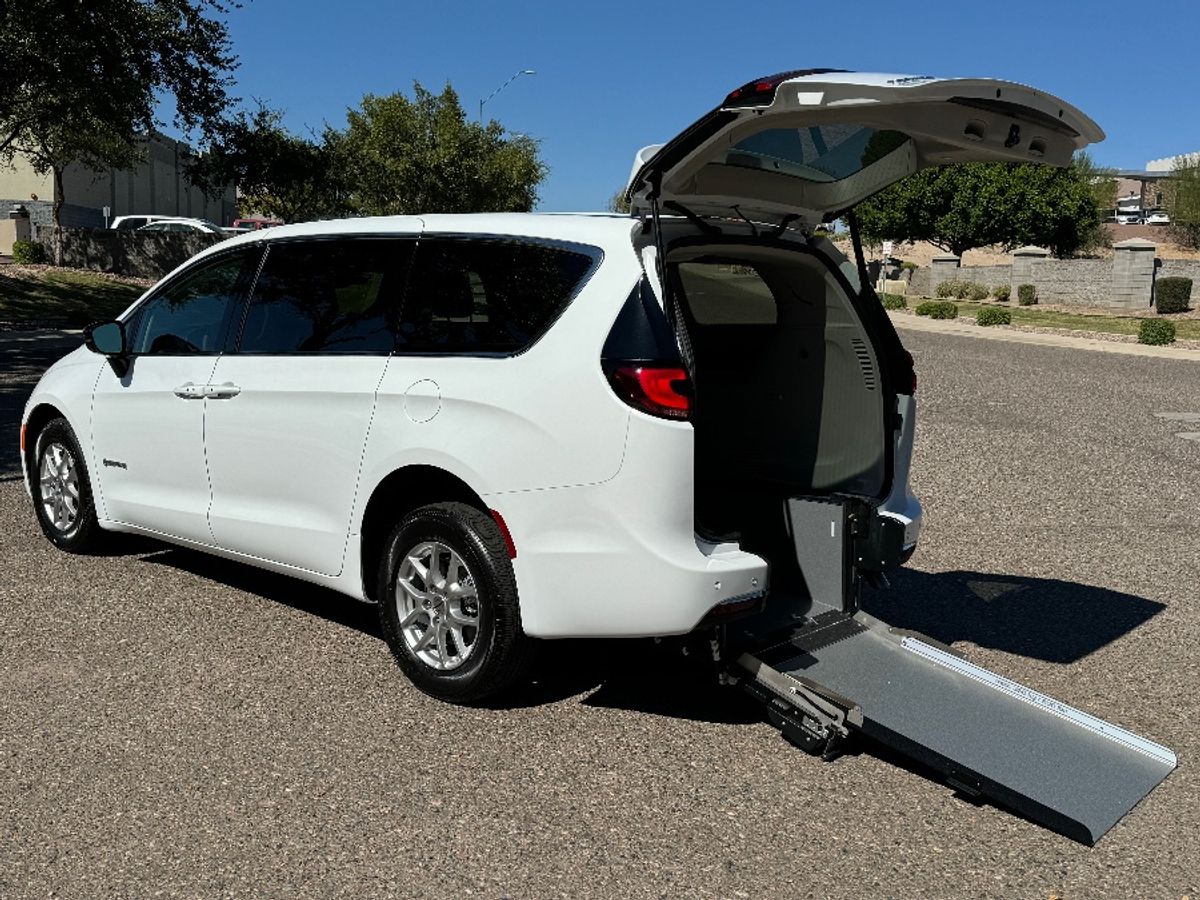 White Chrysler Pacifica with Driverge Rear Entry Manual Fold Out conversion